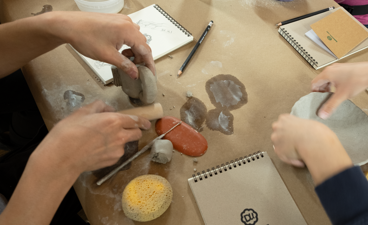 People hand-building ceramics in an artist-led class.