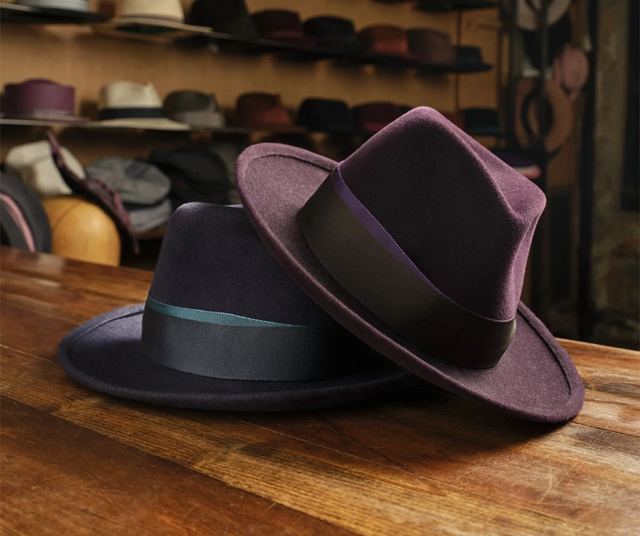 Handmade suede rabbit fur felt homburg hat with an upcurved brim and grosgrain ribbon.
