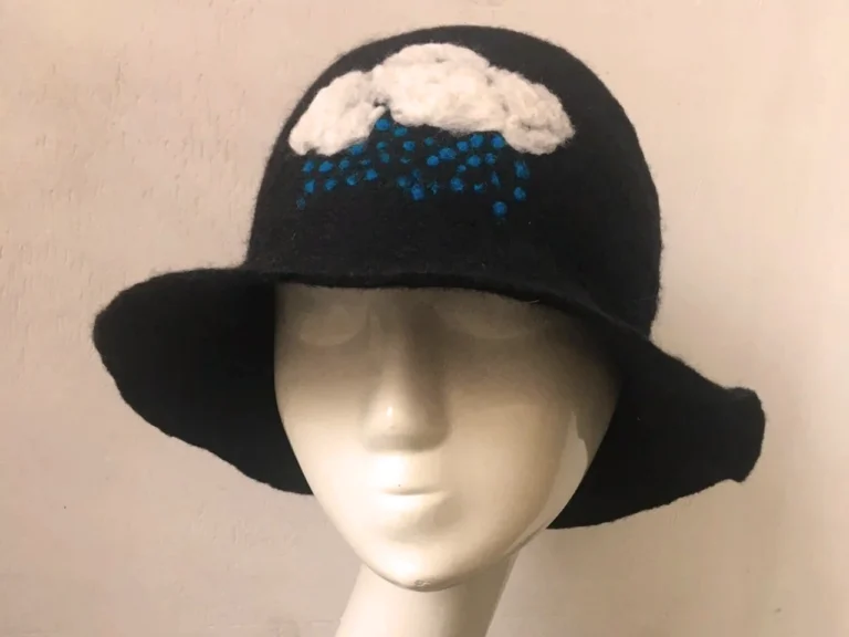 Felt hat decorated with wool using needle felting techniques at East Village Hat