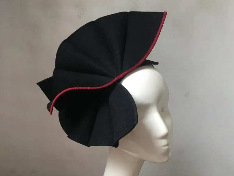 a dramatic cocktail hat made with recycled felt.
